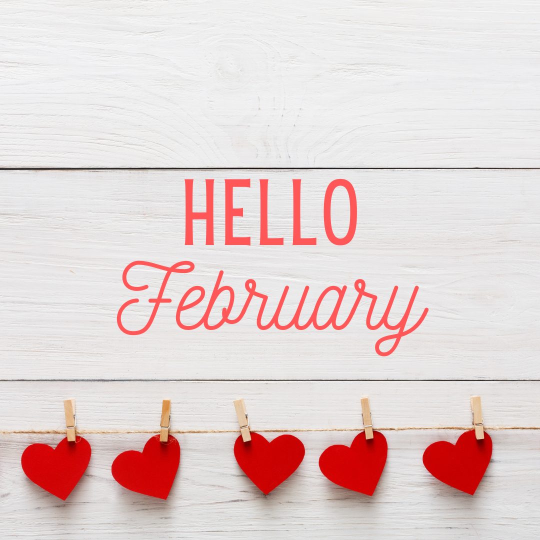 Hello February with a hanging red heart chain that has a white wood background. February 2024 real estate market update