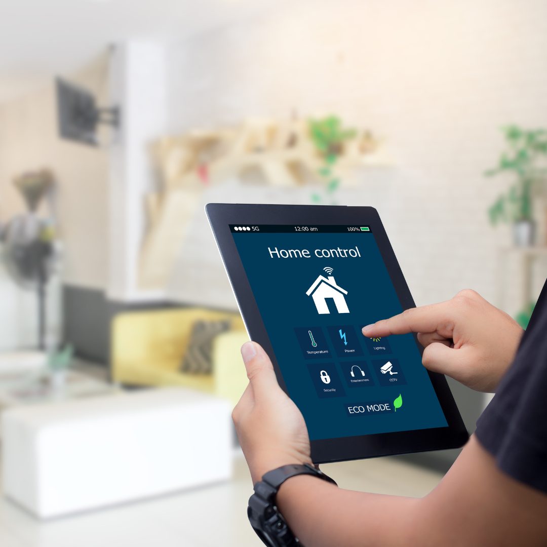 a person holding an ipad that has the home security app open